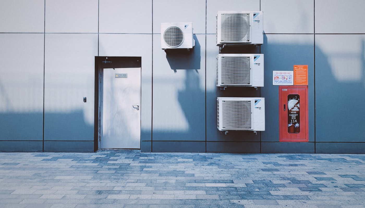 Commercial rooftop and wall-mounted AC condenser units